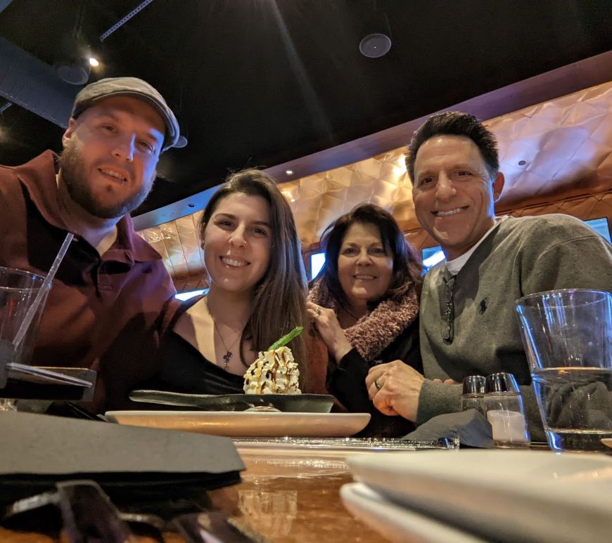 dan, renata, and parents at bar table
