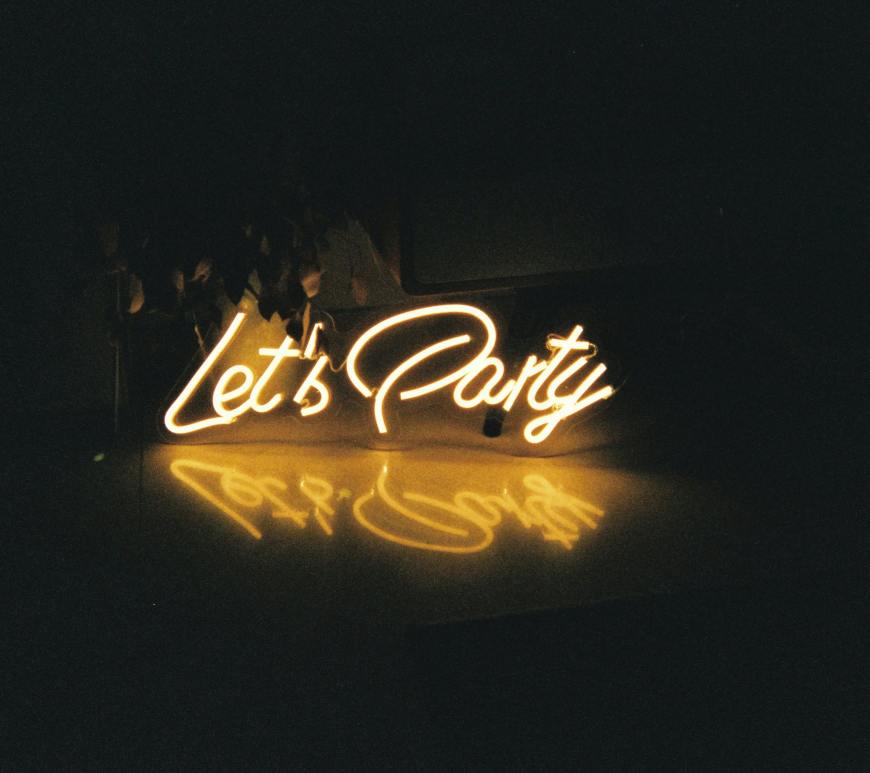 the words "let's party" in neon lights